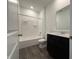 Modern bathroom featuring sleek vanity and a shower and tub combination at 2143 Warbler St, Danville, IN 46122