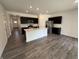 Open-concept kitchen with a center island, stainless steel appliances, and sleek cabinetry at 2143 Warbler St, Danville, IN 46122