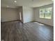 Bright living room with modern flooring, recessed lights and backyard door at 2143 Warbler St, Danville, IN 46122