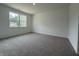 Bedroom featuring neutral paint, carpeted floors, and a large window allowing natural light at 2159 Warbler St, Danville, IN 46122