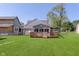 Large backyard featuring a spacious wood deck offers ample room for outdoor activities and enjoyment at 2319 S I St, Elwood, IN 46036