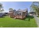 A spacious backyard features a wooden deck and a metal chainlink fence around the property at 2319 S I St, Elwood, IN 46036