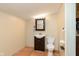 Functional bathroom featuring a toilet, sink, and mirror creating a practical space for everyday needs at 2319 S I St, Elwood, IN 46036