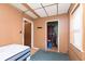 Bedroom with a single bed and a view into a utility area, offering a simple and functional layout at 2319 S I St, Elwood, IN 46036