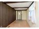 The entryway features a wood paneled wall and a door with a window for natural light at 2319 S I St, Elwood, IN 46036
