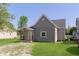 Charming single-story home features gray siding, an eagle over the porch, and a well-maintained front yard at 2319 S I St, Elwood, IN 46036