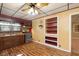 Cozy kitchen features classic appliances and built-in shelving with laminate floors at 2319 S I St, Elwood, IN 46036