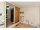 Bright laundry room features washer and dryer hookups and shelving for organized storage options at 2319 S I St, Elwood, IN 46036