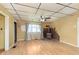 Bright living room features a rustic wood burning stove and large window for natural light at 2319 S I St, Elwood, IN 46036