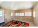 Bright living room with multiple windows providing ample natural light, perfect for relaxation and entertainment at 2319 S I St, Elwood, IN 46036