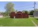 Two sheds on a well-manicured lawn offer extra storage space for gardening tools and outdoor equipment at 2319 S I St, Elwood, IN 46036