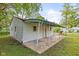 View of the backyard with a covered patio and white siding at 2321 W 26Th St, Anderson, IN 46016