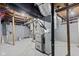 Unfinished basement featuring updated utilities and ductwork, offering potential for customization at 2321 W 26Th St, Anderson, IN 46016