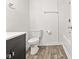 The bathroom features light brown flooring, a white toilet, and a dark vanity at 2321 W 26Th St, Anderson, IN 46016