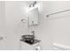 A modern bathroom features a vessel sink with black swirl design and sleek fixtures at 2321 W 26Th St, Anderson, IN 46016