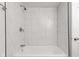 Full bathroom featuring a tiled tub and shower combination with modern fixtures and hardware at 2321 W 26Th St, Anderson, IN 46016