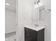 Bathroom featuring a single vanity, mirror, and modern fixtures set against a neutral color palette at 2321 W 26Th St, Anderson, IN 46016