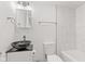 Bathroom features a modern vessel sink, toilet, and bathtub with marbled tile surround at 2321 W 26Th St, Anderson, IN 46016