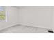 An empty bedroom features light grey carpet, white walls, and a window at 2321 W 26Th St, Anderson, IN 46016
