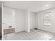 This empty bedroom has grey carpet, an open closet, and a window at 2321 W 26Th St, Anderson, IN 46016