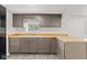 The kitchen is equipped with gray cabinets, butcher block counters, and stainless steel sink at 2321 W 26Th St, Anderson, IN 46016