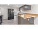 The kitchen boasts butcher block countertops, stainless appliances, and gray cabinetry at 2321 W 26Th St, Anderson, IN 46016