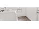 The laundry room features a white washer, window, and light brown flooring at 2321 W 26Th St, Anderson, IN 46016