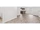Open living room with hardwood floors transitions into a charming kitchen with breakfast bar seating at 2321 W 26Th St, Anderson, IN 46016