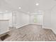 Bright, open-concept living area with modern flooring, and neutral color palette at 2321 W 26Th St, Anderson, IN 46016