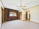 Cozy bedroom with brick accent wall, neutral carpet, and a ceiling fan at 238 Jefferson St, Pendleton, IN 46064