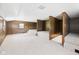 Large upper bonus room with unique design and plush neutral carpeting at 238 Jefferson St, Pendleton, IN 46064