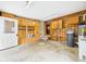 A spacious garage has lots of storage cabinets, a water heater, and a white door leading outside at 238 Jefferson St, Pendleton, IN 46064