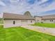 Detached garage with an adjacent lot and a view of the main home at 238 Jefferson St, Pendleton, IN 46064