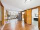 Kitchen features stainless appliances, rustic cabinets, and sleek wood floors at 238 Jefferson St, Pendleton, IN 46064