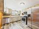 Well-lit kitchen boasts stainless steel appliances and ample counter space at 238 Jefferson St, Pendleton, IN 46064