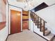 Spacious landing area with carpeting, stairs, and built-in shelves at 238 Jefferson St, Pendleton, IN 46064