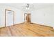 Bright living room featuring hardwood floors, white walls, and a white front door at 238 Jefferson St, Pendleton, IN 46064