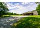 Large, open-sided barn with ample parking and storage space, set in a picturesque landscape at 2508 Indian Creek Rd, Trafalgar, IN 46181