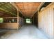 Spacious barn interior featuring multiple stalls and a well-maintained concrete floor at 2508 Indian Creek Rd, Trafalgar, IN 46181