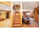 Finished basement with stairs leading to a cozy living area and egress at 2508 Indian Creek Rd, Trafalgar, IN 46181