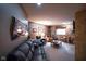Cozy basement featuring carpeted floors, a large sofa, a window for natural light, and decorative wall art at 2508 Indian Creek Rd, Trafalgar, IN 46181