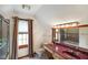 A well-lit bathroom is equipped with a toilet, vanity, sink, mirror, and enclosed shower at 2508 W Indian Creek Rd, Trafalgar, IN 46181