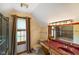 Bathroom with a classic vanity, patterned floors, and natural light from the window at 2508 Indian Creek Rd, Trafalgar, IN 46181