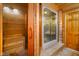 Bathroom boasting a sauna, glass door shower, and wooden accents at 2508 Indian Creek Rd, Trafalgar, IN 46181