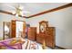 This bedroom includes a decorative trim, natural light, and a connecting bathroom at 2508 W Indian Creek Rd, Trafalgar, IN 46181