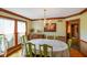 Elegant dining room featuring beautiful wood trim and natural light from large windows at 2508 Indian Creek Rd, Trafalgar, IN 46181