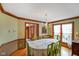 Formal dining room with hardwood floors, decorative trim, and large windows at 2508 Indian Creek Rd, Trafalgar, IN 46181