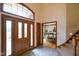 Grand foyer with a soaring ceiling, tile flooring, and stairs to the second level at 2508 Indian Creek Rd, Trafalgar, IN 46181