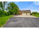 Spacious home showcasing a large attached garage and a long, private driveway at 2508 Indian Creek Rd, Trafalgar, IN 46181