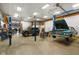 This enormous garage has cars on lifts, providing ample space to work and store vehicles at 2508 Indian Creek Rd, Trafalgar, IN 46181